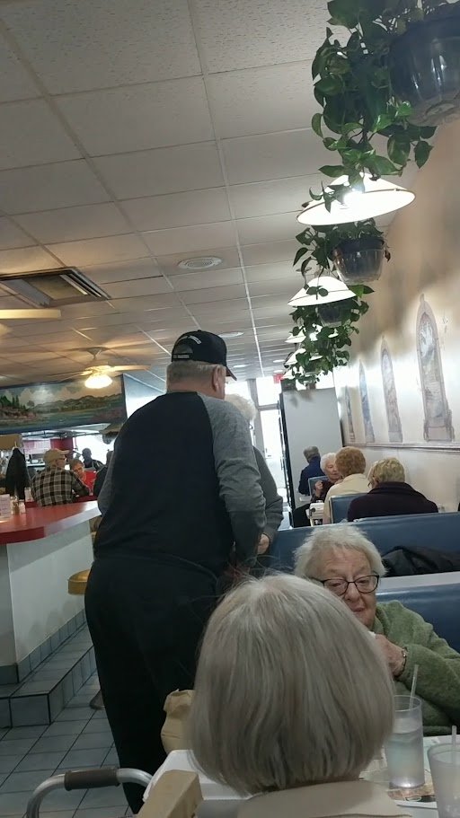 Quiet interior with chairs and booths.
